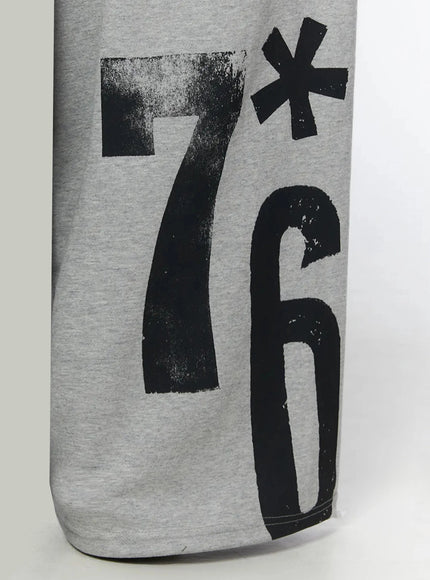 Graphic Sweatpants IL509 Gray close-up detail of lower leg showing bold brushstroke 7*6 number graphic print on heathered cotton fleece fabric