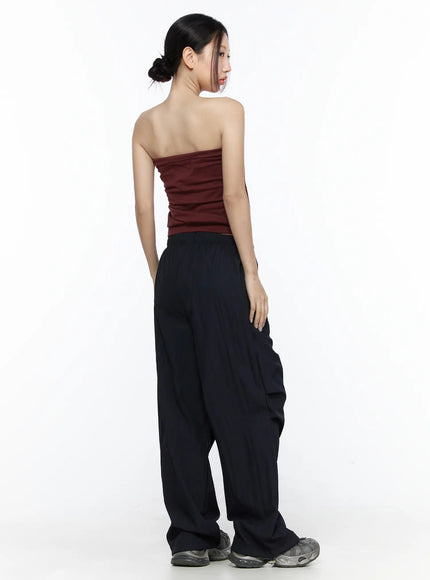 Graphic Tube Top CL527 Dark red back model shot full-length pose showing clean strapless back and ribbed hem band styled with oversized black cargo pants
