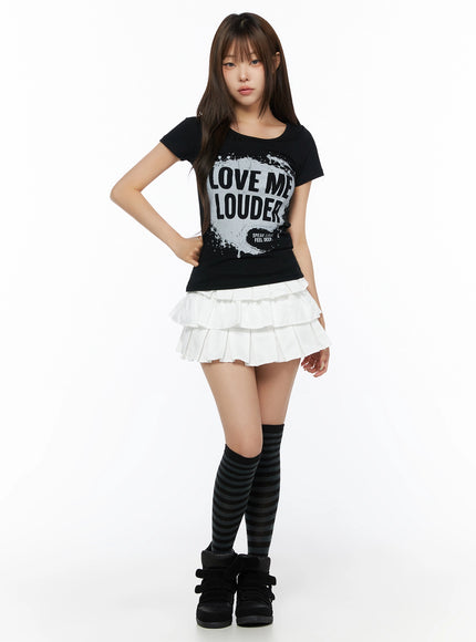 Graphic U-Neck Tee IL523 Black full front view on model with striped knee-high socks and platform sneakers, fitted silhouette with LOVE ME LOUDER graphic