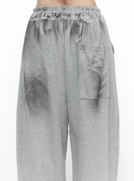 Graphic Wide Leg Sweatpants CL527 Gray close-up back shot on model showing elastic gathered waistband back patch pocket and heathered cotton texture