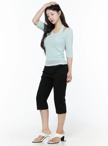 Halter Layered Three-Quarter Sleeve Top IU525 Mint dynamic side full-body shot on model hand raised to head styled with black cropped pants and white sandals