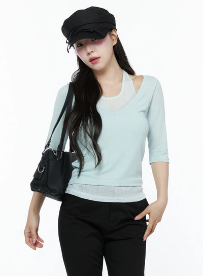 LEWKIN Halter Layered Three-Quarter Sleeve Top IU525 Mint front shot on model wearing black baker boy cap and black bag styled with black trousers