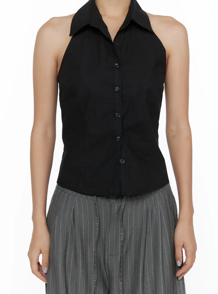 Halter Sleeveless Shirt CL510 Black close-up front shot on model showing button placket, halter collar, open bare back, cropped hemline detail