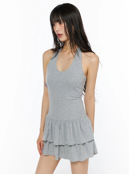 LEWKIN Halter Tiered Mini Dress CU530 Gray side-angle shot on model wearing ribbed halter mini dress with double tiered ruffle skirt