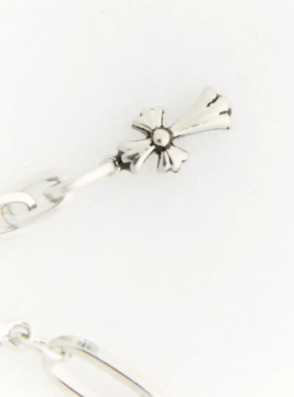 Haven Bold Heart Bracelet IL522 silver close-up detail of oxidized floral cross charm with textured petal design