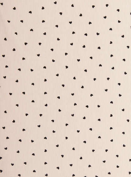Heart Polka Dot Tank Top IU525 close-up fabric detail showing scattered black heart print on cream ribbed knit texture, alternate colorway