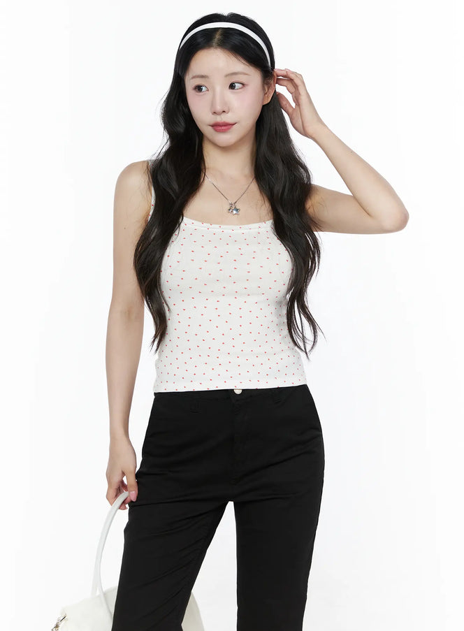 LEWKIN Heart Polka Dot Tank Top IU525 White front view on model wearing headband, paired with black pants, showing red heart print ribbed fabric