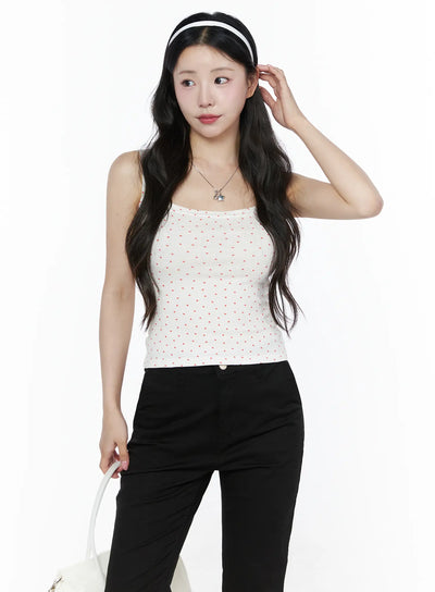 LEWKIN Heart Polka Dot Tank Top IU525 White front view on model wearing headband, paired with black pants, showing red heart print ribbed fabric