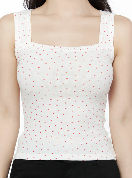 Heart Polka Dot Tank Top IU525 White close-up front detail on model showing square neckline, wide straps, and scattered red heart print on ribbed fabric