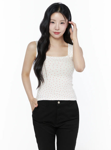 Heart Polka Dot Tank Top IU525 White front half-body shot on model hand in hair, showing square neckline detail and all-over red heart print on ribbed knit
