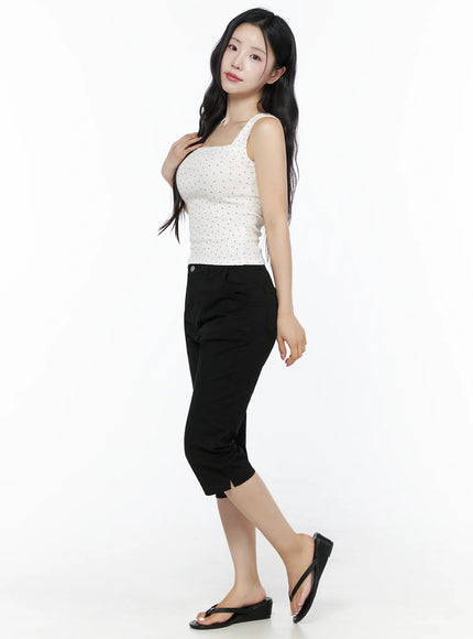 Heart Polka Dot Tank Top IU525 White side three-quarter view on model with hand on chest, showing fitted silhouette and red heart pattern on ribbed tank