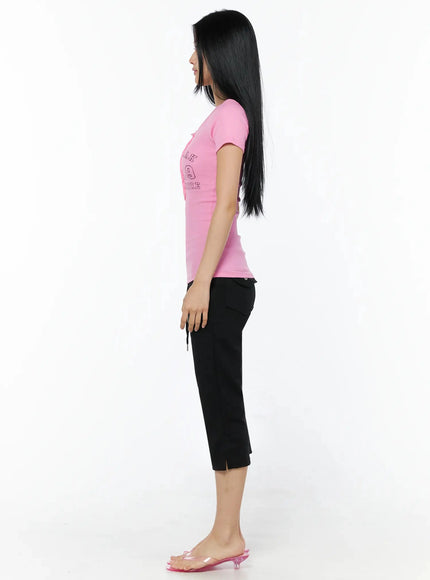 Henley Graphic Tee IL509 Pink true side shot model standing profile revealing slim fitted ribbed silhouette short sleeve hem and body-hugging cut