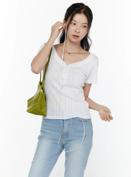 LEWKIN Henley Short Sleeve Tee CL521 White S/M front shot model wearing pointelle knit tee with V-neckline buttons styled with light blue jeans and green tote bag