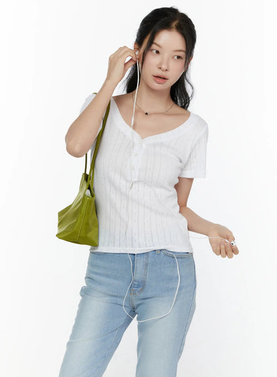 LEWKIN Henley Short Sleeve Tee CL521 White S/M front shot model wearing pointelle knit tee with V-neckline buttons styled with light blue jeans and green tote bag