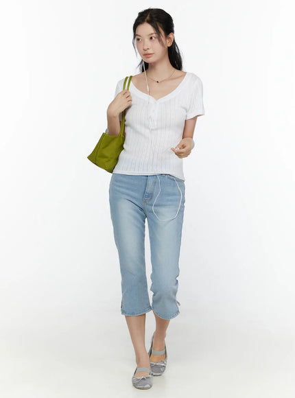 Henley Short Sleeve Tee CL521 White full-body front shot model in pointelle ribbed knit tee with light blue cropped jeans silver ballet flats and green shoulder bag