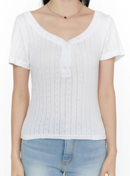Henley Short Sleeve Tee CL521 White close-up front detail shot showing sweetheart V-neckline button placket and vertical pointelle dot knit pattern on model