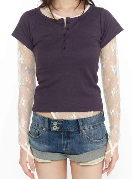 Henley Short Sleeve Tee CL523 Purple close-up front detail on model showing button henley placket, cream contrast neckline trim and sheer floral lace sleeves