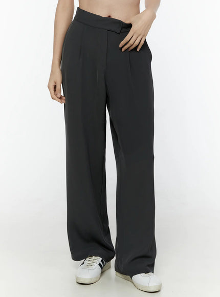 Hidden Buckle Wide Leg Tailored Pants IL506 Dark gray front close-up on model showing high waist, front pleats and asymmetric hidden buckle waistband detail