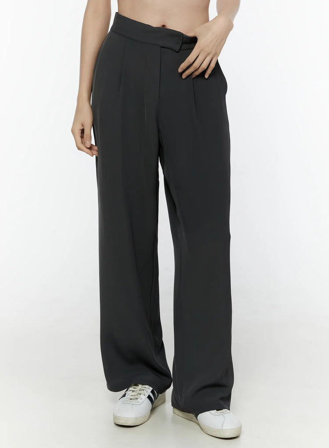 Hidden Buckle Wide Leg Tailored Pants IL506 Dark gray front close-up on model showing high waist, front pleats and asymmetric hidden buckle waistband detail
