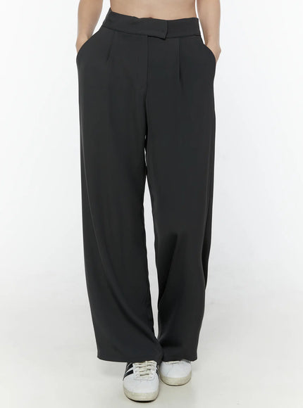 Hidden Buckle Wide Leg Tailored Pants IL506 Dark gray front product shot on model from waist to hem showing pleated wide leg and sneaker pairing