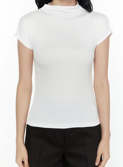High Neck Cap Sleeve Top CL521 White close-up front detail on model highlighting ribbed fabric mock neck and body-hugging fit