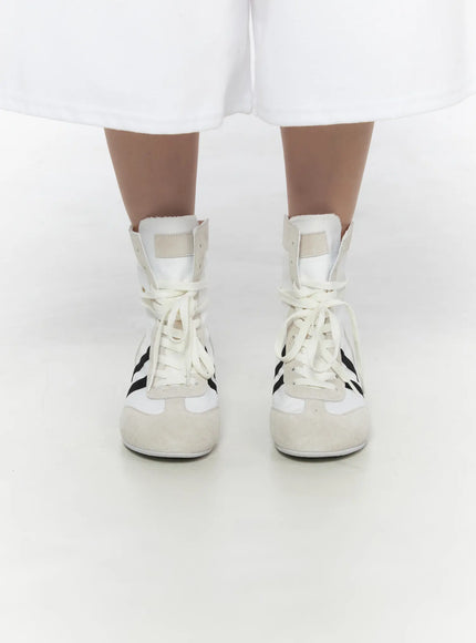 High Top Sneakers CL527 White front close-up on model both feet together, cream laces and black double-stripe detail on nylon upper