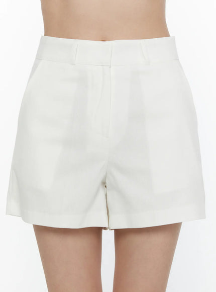 High-Waist Cotton Shorts CL521 White close-up front view on model showing high waistband belt loops and clean tailored silhouette