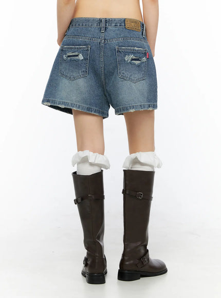High-Waist Denim Jorts CU530 Dark blue back full-body shot on model with hands on hips, styled with brown crop tee and dark leather knee-high boots