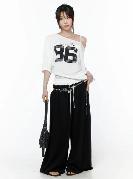 High-Waist Lace Wide Leg Sweatpants IL506 Black full-body front model shot styled with white 86 graphic tee silver chain belt and polka dot bag facing camera