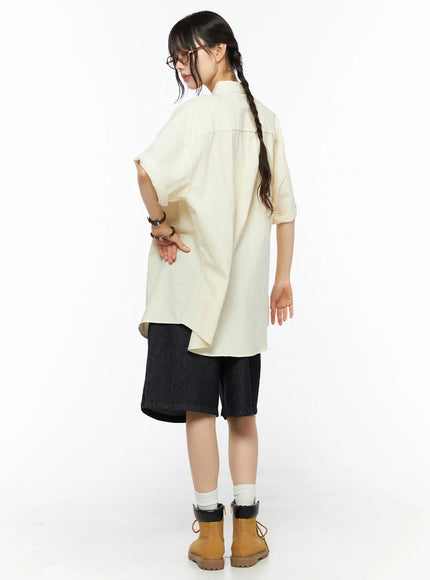 High-Waist Pintuck Jorts CU530 black side back outfit shot on model looking down in cream oversized shirt showing hem length and wide leg