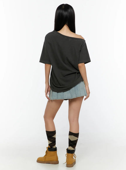 High-Waist Pleated Denim Mini Skirt CU529 Light blue back outfit shot model in dark off-shoulder tee showing pleated skirt rear