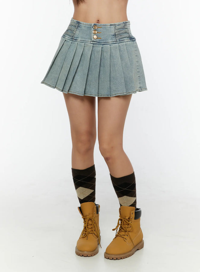LEWKIN High-Waist Pleated Denim Mini Skirt CU529 Light blue front view on model wearing tan boots and argyle socks