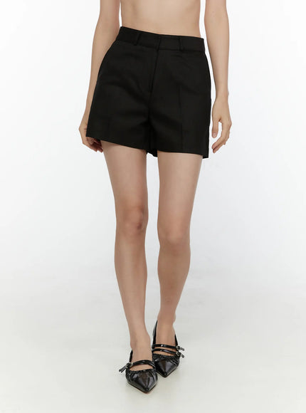 High-Waist Tailored Shorts CL521 black front shot on model showing structured high waist, center pleat, and hem length