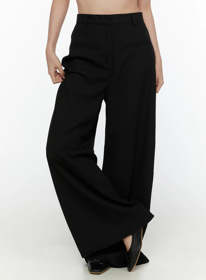 LEWKIN High-Waist Wide Leg Tailored Pants (Black) CL520 Black Size S front close-up on model showing high waist, belt loops, and wide flared leg with black heeled mules
