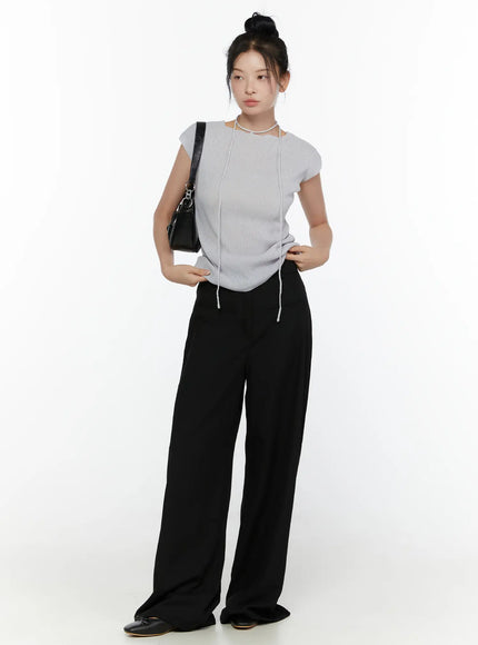 High-Waist Wide Leg Tailored Pants (Black) CL520 Black full-length front shot on model styled with grey ribbed top, chain necklace, and black shoulder bag with ballet flats