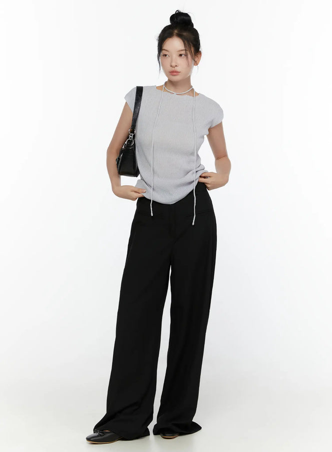 High-Waist Wide Leg Tailored Pants (Black) CL520 Black full-length front shot on model styled with grey ribbed top, chain necklace, and black shoulder bag with ballet flats