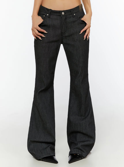 LEWKIN Hina No-Fade Bootcut Flared Jeans IL524 Black front close-up on model hands in pockets showing low-rise waist silver button and denim texture