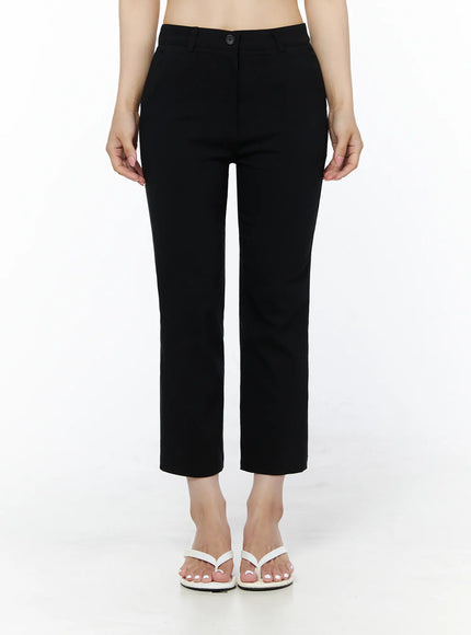 LEWKIN Hip-Pad Capri Slacks IU525 Black front view on model, cropped straight-leg trousers with button closure, styled with white crop top and white sandals