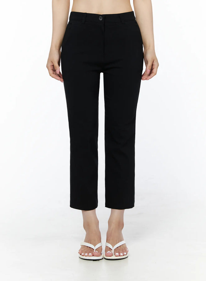 LEWKIN Hip-Pad Capri Slacks IU525 Black front view on model, cropped straight-leg trousers with button closure, styled with white crop top and white sandals
