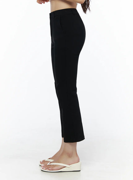 Hip-Pad Capri Slacks IU525 Black side view on model showing slim straight leg and waistband profile, white crop top, white wedge flip-flops