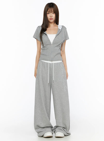 Hooded Short Sleeve Zip-Up IL515 Gray front full-body view on model standing neutral pose showing cropped zip-up with wide-leg pants