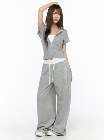 Hooded Short Sleeve Zip-Up IL515 Gray full-body front view on model with arm raised showing cropped silhouette and rhinestone pants detail