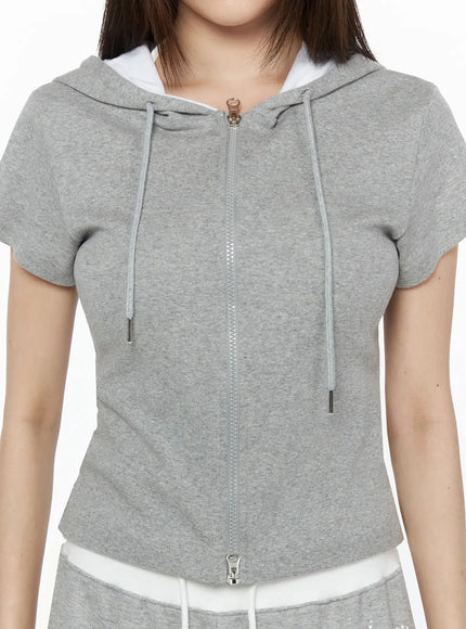 Hooded Short Sleeve Zip-Up IL515 Gray close-up front view on model showing zip closure drawstring hood and ribbed cotton texture