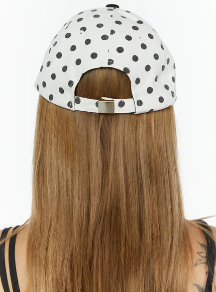 Hudson Ball Cap IL503 white black back model shot rear view polka dot crown metal snapback adjuster worn on model showing ponytail opening