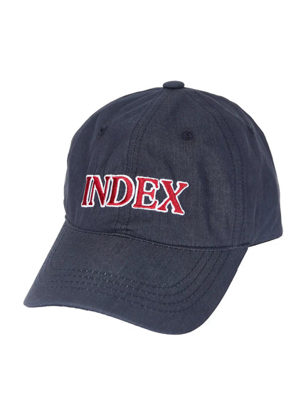 Index Cotton Ball Cap IL503 Navy angled product shot on white background, red and white INDEX embroidery on front panel, six-panel cotton twill construction