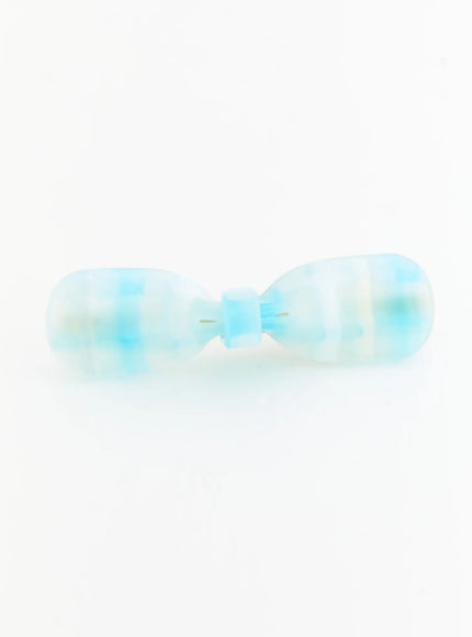Ivy Mix Hair Pin IL503 blue front flat-lay, single clip showing frosted translucent resin bow-tie silhouette with blue marbled pattern