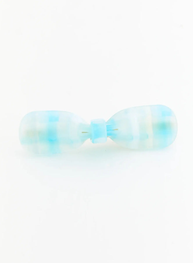 Ivy Mix Hair Pin IL503 blue front flat-lay, single clip showing frosted translucent resin bow-tie silhouette with blue marbled pattern