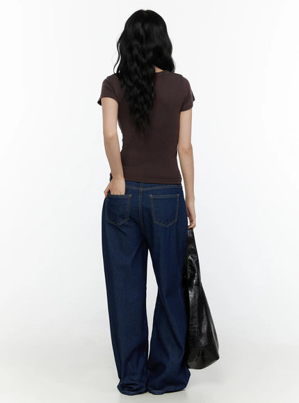 Jael Dark Washed Wide Leg Jeans CL520 Dark blue full-length back view on model styled with brown crop top and black leather tote bag, hand in back pocket