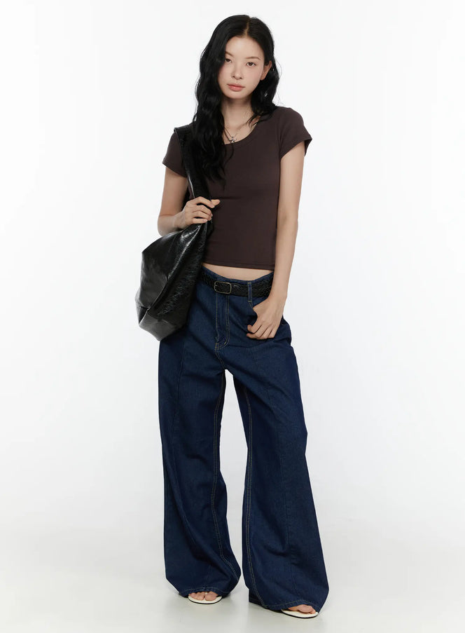 Jael Dark Washed Wide Leg Jeans CL520 Dark blue full-length front view on model styled with brown crop top, braided belt, and black leather tote bag