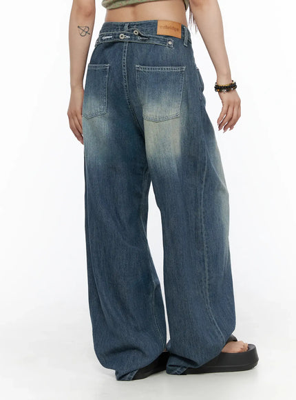 Jesse Vintage Wash Wide Leg Jeans CU530 Blue back three-quarter view on model, ozbridge leather patch visible, wide leg pooling at black sandals